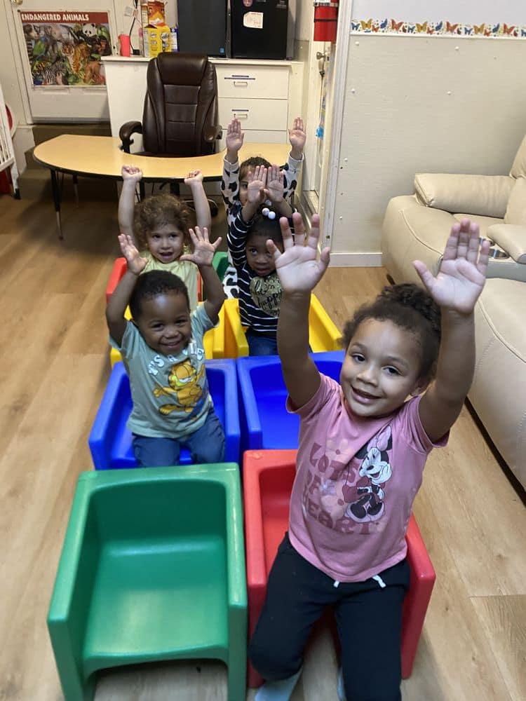 Children exploring colorful classroom activities.