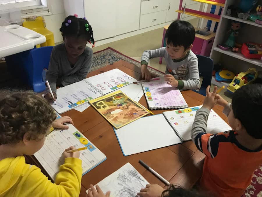 Children quietly listening to a story.